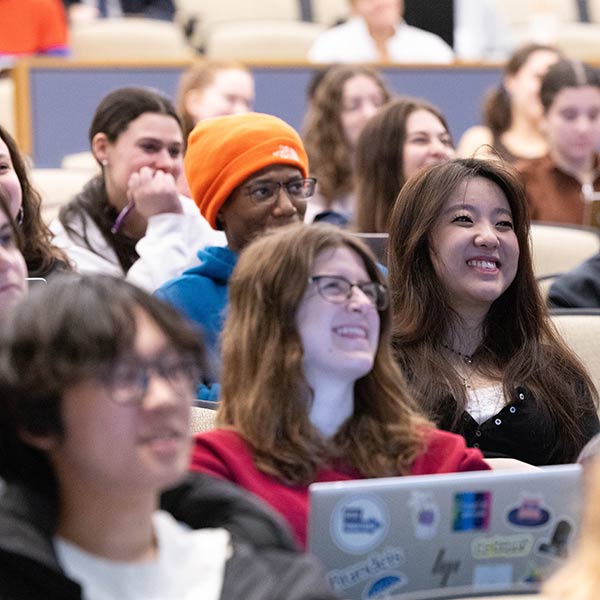 Student looking into a microscope