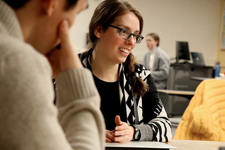 students discussing in class