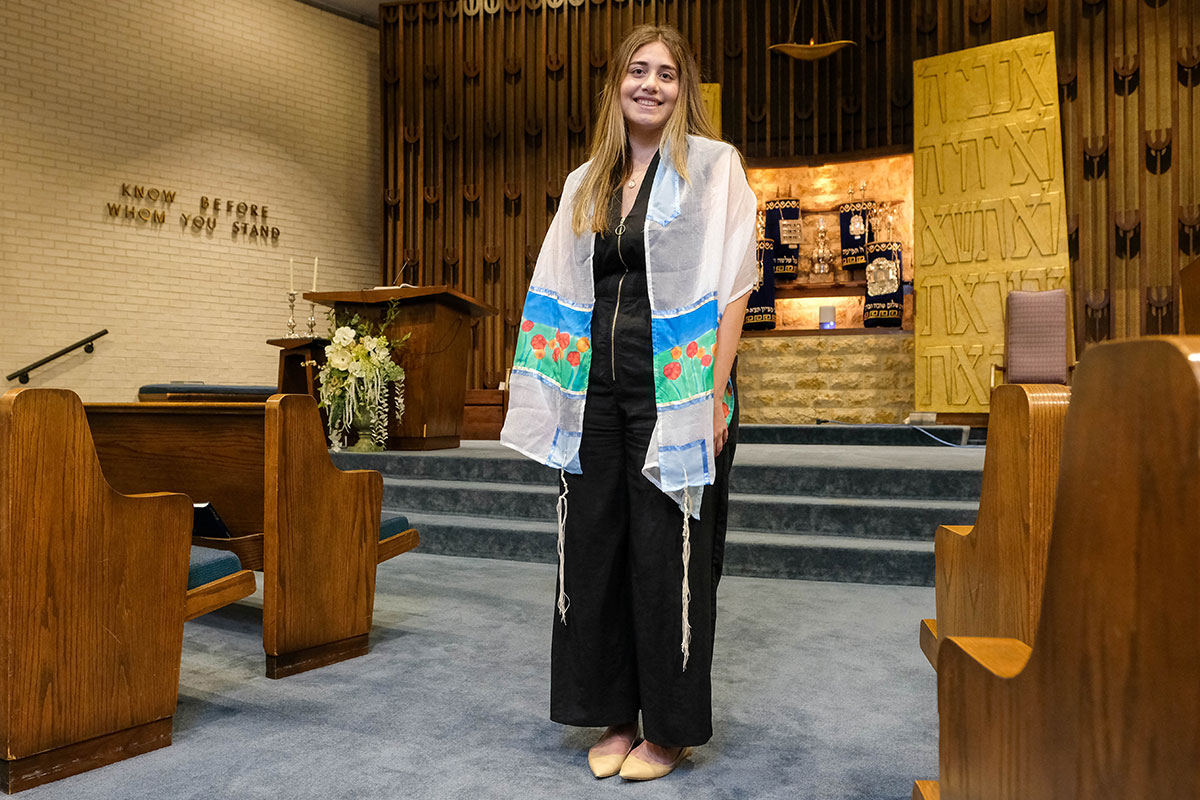 Lauren Balfour standing in a synagogue.