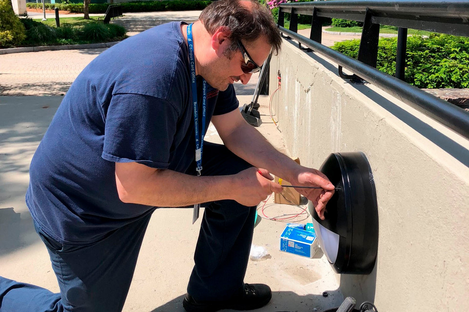 A person fixing a light