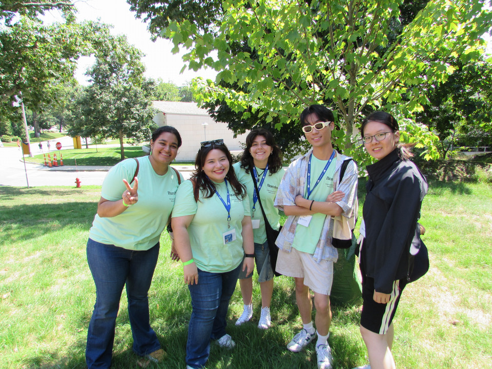 students standing near a tree