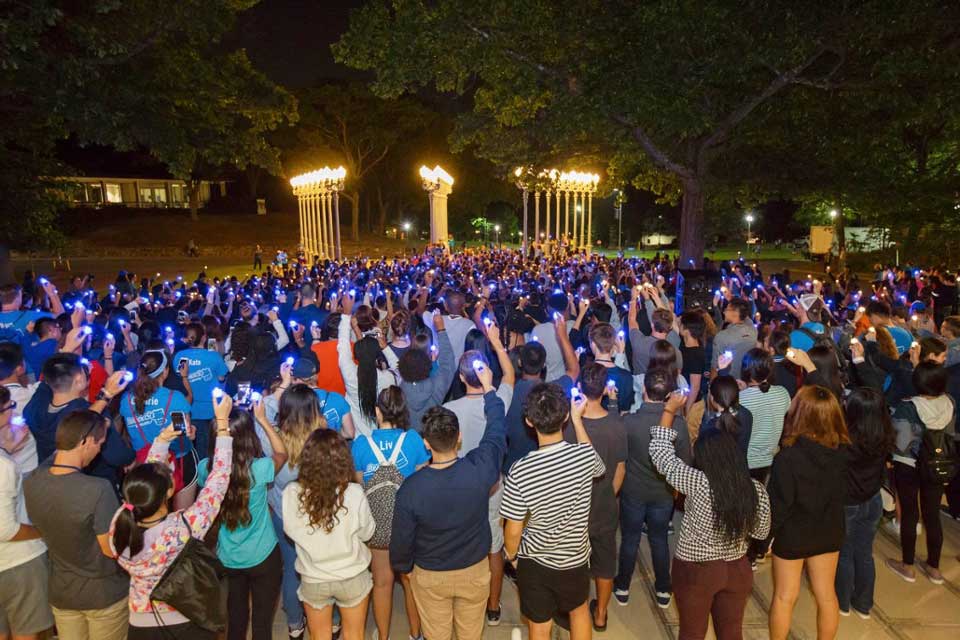 Students standing by the Light of Reason