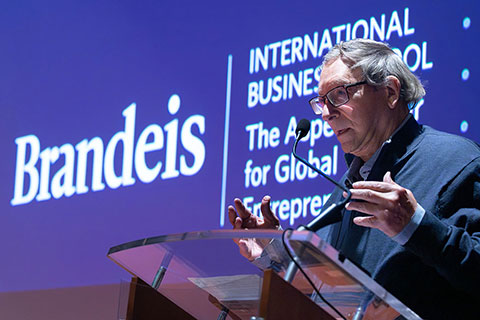 Stuart Weitzman speaks at a podium.